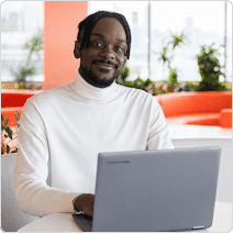 man sitting on the couch with laptop